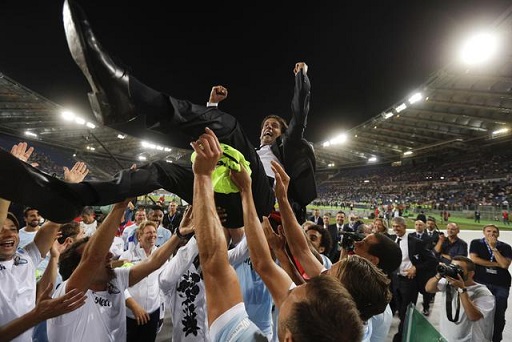 Lazio coach Simone Inzaghi is cheered by his players at the end of the Italian Super Cup final match between Lazio and Juventus at Rome's Olympic stadium, Sunday, Aug. 13, 2017. Lazio won 3-2. (ANSA/AP Photo/Gregorio Borgia) [CopyrightNotice: Copyright 2017 The Associated Press. All rights reserved.]